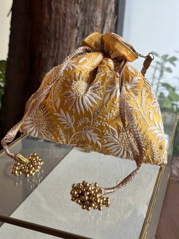 Yellow Handcrafted Silk Chikankari Potli Bags With Ari Work