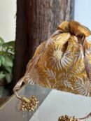 Yellow Handcrafted Silk Chikankari Potli Bags With Ari Work