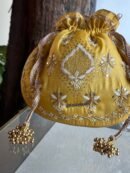 Yellow Handcrafted Silk Chikankari Potli Bags With Ari Work and Mukaish Kamdani