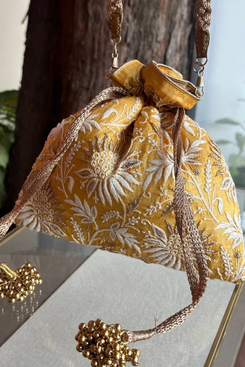 Yellow Handcrafted Silk Chikankari Potli Bags With Ari Work